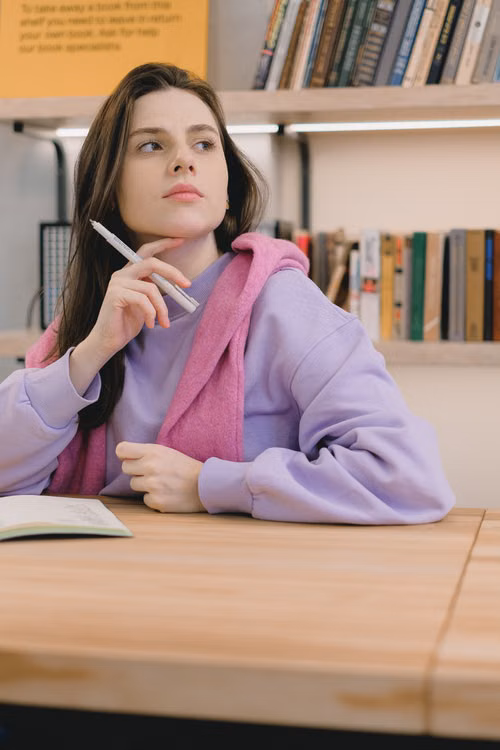 A student thinking while studying